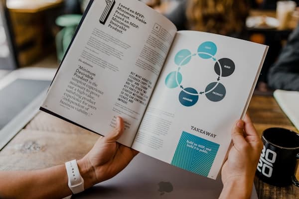 Modern technology workspace with AI tools and strategic planning documents